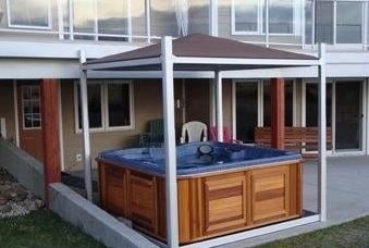 arctic spas hot tub on patio with cover